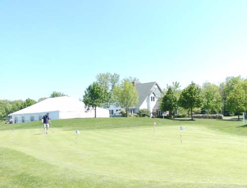 Golfer practices on putting green